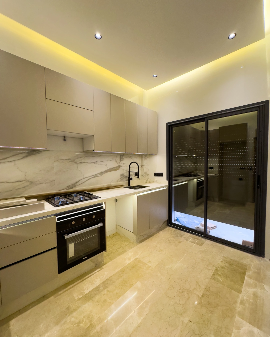modern kitchen with large windows in high-end apartment for sale in Valfleuri Tangier